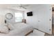 Bedroom featuring carpeted floors, modern decor, and a window with natural light at 9980 Sago Point Dr, Seminole, FL 33777