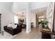 Spacious open-concept living area with high ceilings, hardwood floors, and stylish furniture at 9980 Sago Point Dr, Seminole, FL 33777