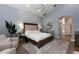 Inviting main bedroom features a ceiling fan, sitting area, and a peaceful atmosphere at 9980 Sago Point Dr, Seminole, FL 33777