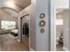 Bright main bedroom boasts wood flooring, ceiling fan, and ensuite bathroom at 9980 Sago Point Dr, Seminole, FL 33777