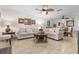 Open concept living room features neutral paint, tile floors, and designer ceiling fan at 1002 Cordova Grn, Seminole, FL 33777