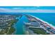 An aerial view showcases the coastline and waterway that features luxurious waterfront homes at 10190 Imperial Point W Dr # 8, Largo, FL 33774