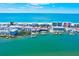 An aerial view showcases the coast and waterways, with boats docked near waterfront homes at 10190 Imperial Point W Dr # 8, Largo, FL 33774