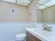 Bathroom showcasing modern fixtures, vanity, and toilet against paneled walls at 10190 Imperial Point W Dr # 8, Largo, FL 33774