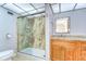 Bathroom featuring glass enclosed shower and updated vanity at 10190 Imperial Point W Dr # 8, Largo, FL 33774