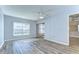 Bedroom featuring new vinyl floors, ceiling fan, and sliding glass doors at 10190 Imperial Point W Dr # 8, Largo, FL 33774