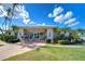Inviting clubhouse with stone accents, lush landscaping, and a welcoming entrance for residents and guests at 10190 Imperial Point W Dr # 8, Largo, FL 33774
