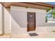 Exterior of the building shows the landscape and the door to the laundry room at 10190 Imperial Point W Dr # 8, Largo, FL 33774