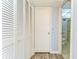 Hallway with ample closet space and access to the bathroom at 10190 Imperial Point W Dr # 8, Largo, FL 33774