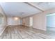 Light-filled living room featuring modern lighting, vinyl floors, and neutral walls at 10190 Imperial Point W Dr # 8, Largo, FL 33774