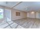 Bright living room featuring new vinyl floors, modern lighting, and neutral walls at 10190 Imperial Point W Dr # 8, Largo, FL 33774