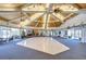 Expansive recreation hall featuring a unique wooden ceiling, spacious dance floor, and festive holiday decorations at 10190 Imperial Point W Dr # 8, Largo, FL 33774