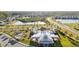 Aerial view showcasing the community pool, clubhouse, playground, and surrounding homes at 10196 Cross Timber Ter, Land O Lakes, FL 34638