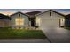 Charming single-story home featuring a well-manicured lawn, neutral exterior, and an attached two-car garage at 10196 Cross Timber Ter, Land O Lakes, FL 34638