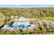 Community pool boasts spacious lounging area and Gathering-friendly splashpad with playgrounds and picnic areas at 10196 Cross Timber Ter, Land O Lakes, FL 34638