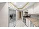 Kitchen features stainless steel refrigerator, and updated appliances at 112 Rosewood Ct, Palm Harbor, FL 34685