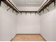 Spacious walk-in closet with built-in shelving and hanging rods for ample storage at 112 Rosewood Ct, Palm Harbor, FL 34685