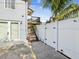 Exterior view of stairs to an upper deck and a privacy fence at 1225 26Th N St, St Petersburg, FL 33713