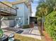 Back of house showing deck, hot tub, and lush landscaping leading to gated area at 1225 26Th N St, St Petersburg, FL 33713