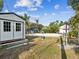 View of the backyard with pool, lush landscaping, shed, and patio area perfect for outdoor entertaining at 1225 26Th N St, St Petersburg, FL 33713