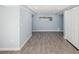 Spacious basement featuring wood-look flooring, a window for natural light, and ample room for various uses at 1225 26Th N St, St Petersburg, FL 33713