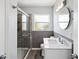 Bathroom features a modern vanity, updated fixtures, and a tiled shower with glass door at 1225 26Th N St, St Petersburg, FL 33713
