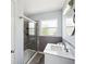 Bathroom features a modern vanity, updated fixtures, and a tiled shower with glass door at 1225 26Th N St, St Petersburg, FL 33713