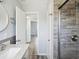 Refreshed bathroom with glass shower, marble vanity, updated lighting, and an inviting view at 1225 26Th N St, St Petersburg, FL 33713