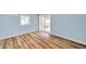 Bedroom with wood floors, natural light, and sliding glass door at 1225 26Th N St, St Petersburg, FL 33713