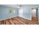Bedroom with wood floors, a window, and closet at 1225 26Th N St, St Petersburg, FL 33713