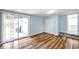 Bedroom with wood floor, large sliding glass door, and neutral colors at 1225 26Th N St, St Petersburg, FL 33713