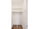 Walk-in closet with wood floors, shelving and bar for hanging clothes at 1225 26Th N St, St Petersburg, FL 33713