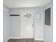 Hallway showing front door, coat hooks, and electrical panel at 1225 26Th N St, St Petersburg, FL 33713
