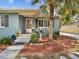 Close up view of the inviting front porch, exterior with well manicured landscaping at 1225 26Th N St, St Petersburg, FL 33713