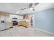 Spacious kitchen with stainless steel appliances, tile flooring, and modern cabinetry at 1225 26Th N St, St Petersburg, FL 33713