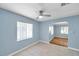 Bright room showcasing the neutral colors, ceiling fan, and tile flooring at 1225 26Th N St, St Petersburg, FL 33713