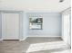Living space with a view of the pool, closet, and new floors at 1225 26Th N St, St Petersburg, FL 33713
