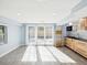 Open concept living space with kitchen, recessed lighting, and sliding door at 1225 26Th N St, St Petersburg, FL 33713