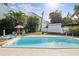 Inviting in-ground pool surrounded by lush greenery, perfect for relaxing and enjoying the outdoors at 1225 26Th N St, St Petersburg, FL 33713