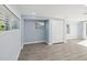 A blue room with a closet and gray wood-look tile flooring at 1225 26Th N St, St Petersburg, FL 33713
