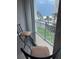 Enjoy ocean views from this balcony with a table, chairs, and a peaceful atmosphere at 1390 Gulf Blvd # 104, Clearwater, FL 33767