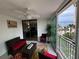 Inviting balcony with comfortable seating and a view of the beach at 1390 Gulf Blvd # 104, Clearwater, FL 33767