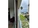 Balcony view overlooking the ocean, sandy beach, and palm trees at 1390 Gulf Blvd # 104, Clearwater, FL 33767