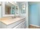 Bright bathroom featuring a white vanity, neutral countertops, and tiled shower at 1390 Gulf Blvd # 104, Clearwater, FL 33767