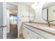 Bright bathroom features double sinks, granite counters, and neutral color palette at 1390 Gulf Blvd # 104, Clearwater, FL 33767