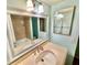 Bathroom featuring a vanity, mirror, and tiled shower/tub at 1390 Gulf Blvd # 104, Clearwater, FL 33767