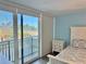 Bright bedroom with a balcony offering beautiful views at 1390 Gulf Blvd # 104, Clearwater, FL 33767