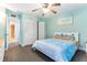 Bright bedroom with a closet, hardwood flooring, and coastal style decor at 1390 Gulf Blvd # 104, Clearwater, FL 33767