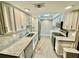 Updated kitchen with white cabinets, stainless steel appliances, and light countertops at 1390 Gulf Blvd # 104, Clearwater, FL 33767