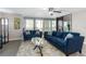 Bright living room with comfortable seating and beach views from the balcony at 1390 Gulf Blvd # 104, Clearwater, FL 33767